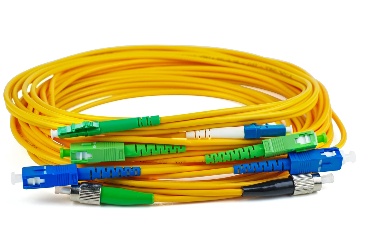 Coiled fiber optic cables with connectors, representing data pipeline infrastructure